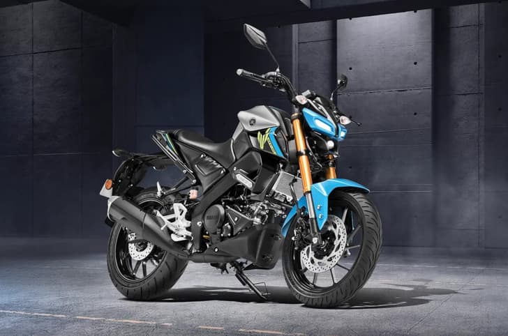 Yamaha MT15 metallic silver cyan colour front right side static image in garage