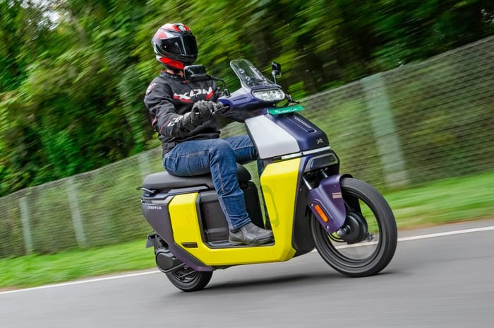 TVS Orbiter front right side riding shot on track