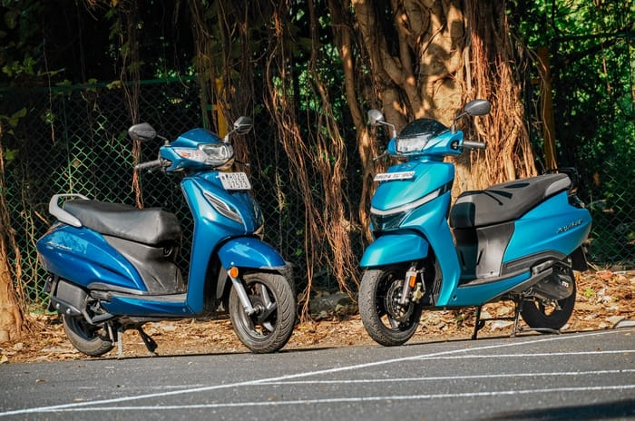 Honda Activa and TVS Jupiter front three quarter static on road