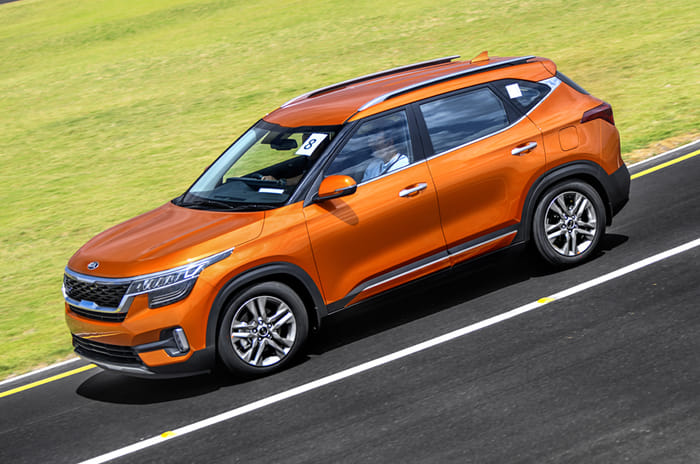 Kia Seltos side action orange
